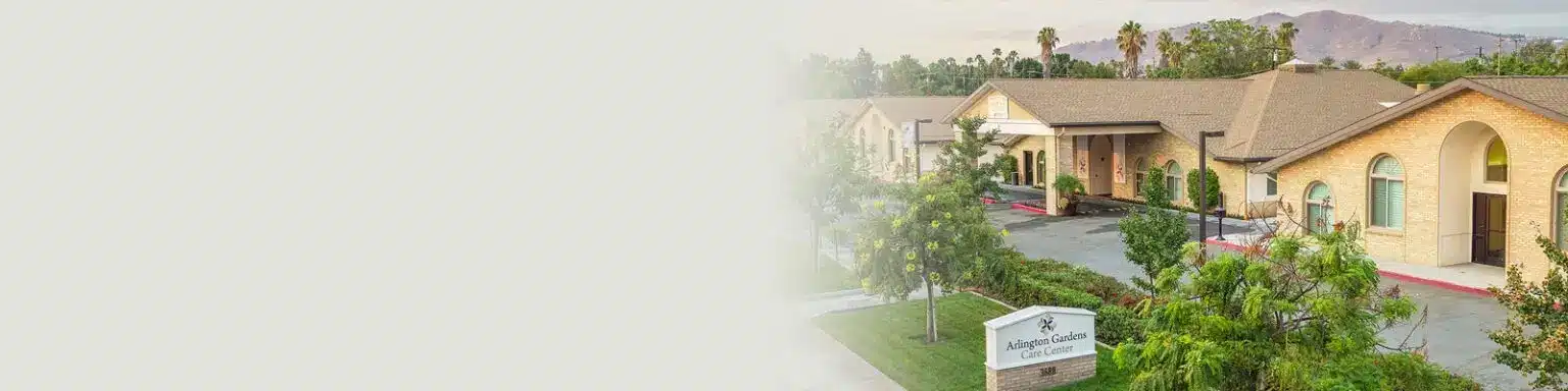 Front of the Arlington Gardens facility including mountains